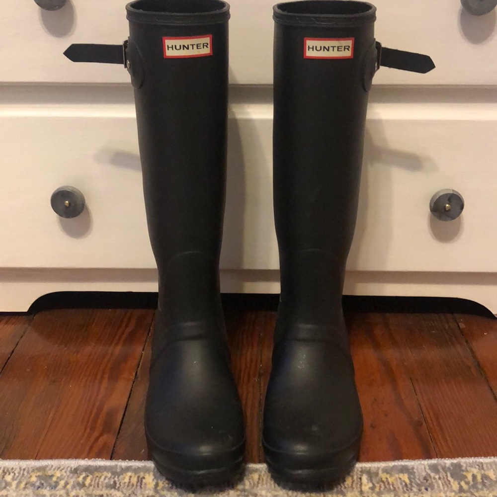 Black tall hunter boots